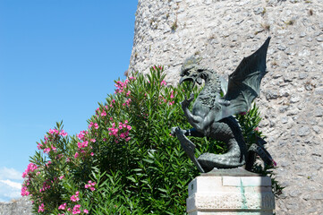 Bronze statue of a dragon, symbol of Trsat, historic landmark in the city Rijeka in Croatia, with...