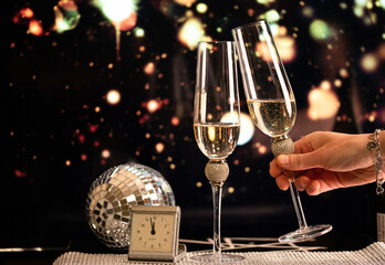 happy New Year champagne glasses and fireworks celebration background