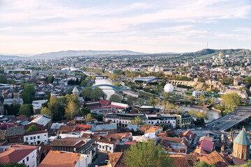 Fototapeta na wymiar Tbilisi, Georgia - 04.18.2021: Aerial view of Tbilisi from the observation deck. High quality photo