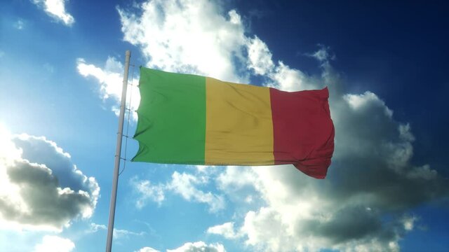 Flag of Mali waving at wind against beautiful blue sky
