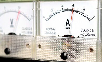 Arrow of the analog DC ampmeter shows the value of .6 amp.                                