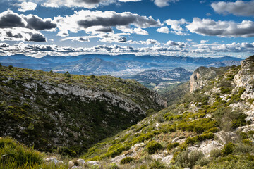 Fototapeta na wymiar Landscape view of the mountains and clouds, beautiful nature of Montgo mountain, Spain