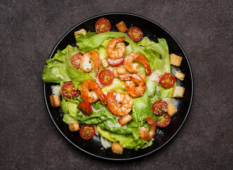 Caesar salad with shrimp, croutons and parmesan