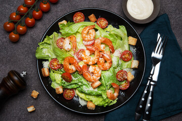 Caesar salad with shrimp, croutons and parmesan