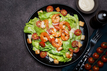 Caesar salad with shrimp, croutons and parmesan