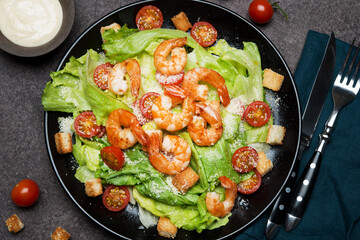 Caesar salad with shrimp, croutons and parmesan