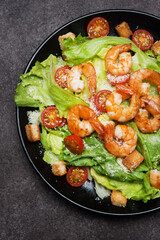 Caesar salad with shrimp, croutons and parmesan