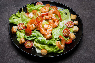 Caesar salad with shrimp, croutons and parmesan