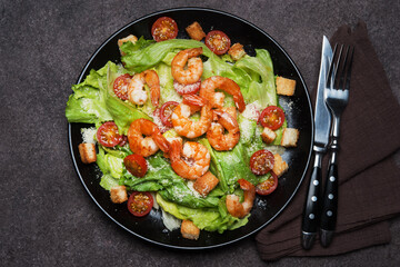 Caesar salad with shrimp, croutons and parmesan