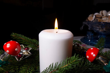 Christmas decoration with a candle on the table during Christmas Eve