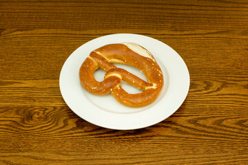 one type of cookie is baked and twisted into a bun, with a slightly salty taste. Its origin is in Germany, and it is quite popular in Switzerland, Austria,