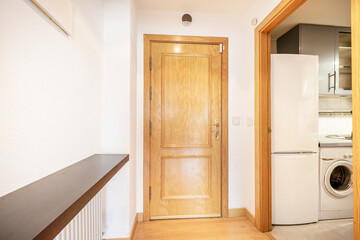 Fototapeta premium Entrance to apartment next to the kitchen and a ledge above the radiator