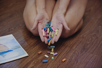 a lot of pencils in the hands of a woman artist