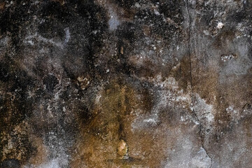 Rusty old broken concrete wall with dried moss and grunge texture for background