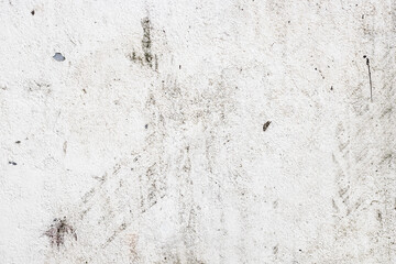 White painted old abandoned concrete wall surface with dust and spots for texture background
