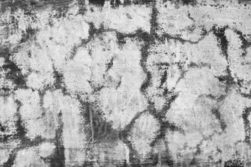 Monochromatic view of a damaged seamless cement plaster wall for texture background
