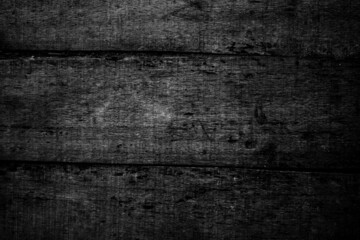 Aged dark wooden texture background of damaged planks