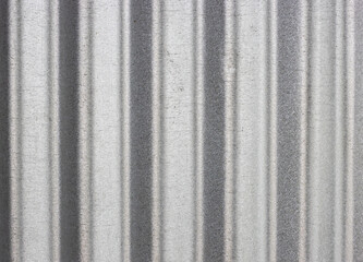 Old silver color corrugated sheet with scattered mild grunge texture for background