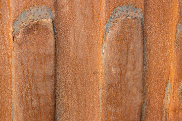 Brown rust on an old abandoned iron sheet surface for background