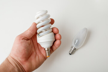 Burnt out energy-saving lamps on a white background