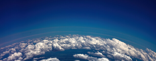 Fototapeta Curvature of planet earth. Aerial shot. Blue sky and clouds obraz