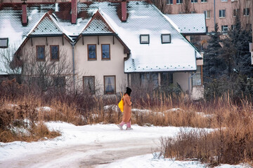 girl walking away from home