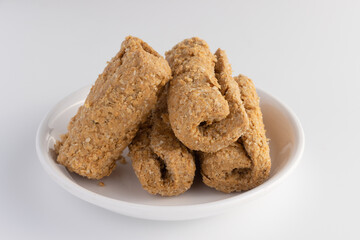 Indian traditional sweets for Makar Sankranti Or Lohri Mithai Gajak Also Known As Gur Gajjak, Gazak, Gachak Til Patti Or Papdi, Chikki Is Made Of Jaggery Gud, Almonds Badam And Pistachio