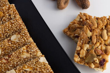 Indian traditional sweets for Makar Sankranti Or Lohri Mithai Gajak Also Known As Gur Gajjak, Gazak, Gachak Til Patti Or Papdi, Chikki Is Made Of Jaggery Gud, Almonds Badam And Pistachio