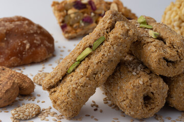Indian traditional sweets for Makar Sankranti Or Lohri Mithai Gajak Also Known As Gur Gajjak, Gazak, Gachak Til Patti Or Papdi, Chikki Is Made Of Jaggery Gud, Almonds Badam And Pistachio