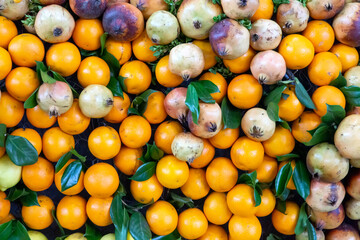 close-up shot of group of oranges and pomegranates