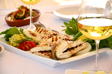 sliced sea bass with white wine and mezes