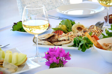 sliced sea bass with white wine and mezes