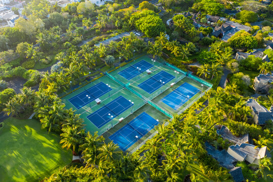 Aerial view of tennis courts near the luxury resort along the coast, Trou aux Biches, Mauritius.