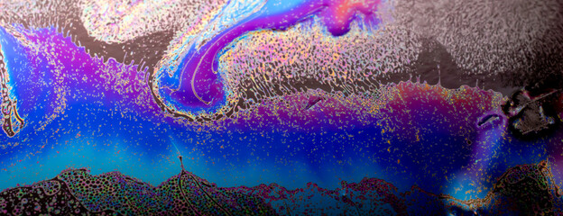 colored stains of gasoline oil on the water, iridescence - obrazy, fototapety, plakaty