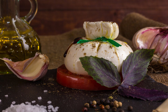 A beautiful composition with burata cheese in a rustic style