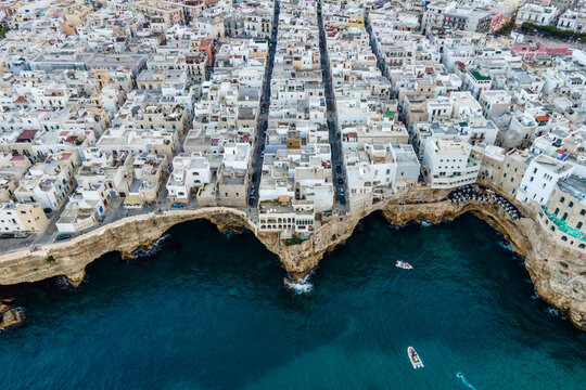 Aerial view of Polignano, a small town in white architecture along the Adriatic Sea near Bari, Puglia, Italy.