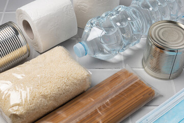 Humanitarian aid, essential products, box with food to support those in need during a pandemic, disaster on a gray background