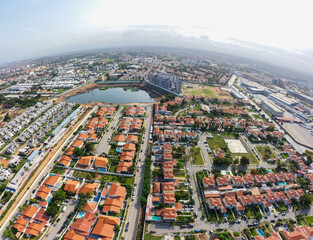 Aerial drone photography of Talatona city in Belas, residential area with condominiums with luxury houses and luxury office buildings, in the metropolitan area of Luanda in Angola - obrazy, fototapety, plakaty