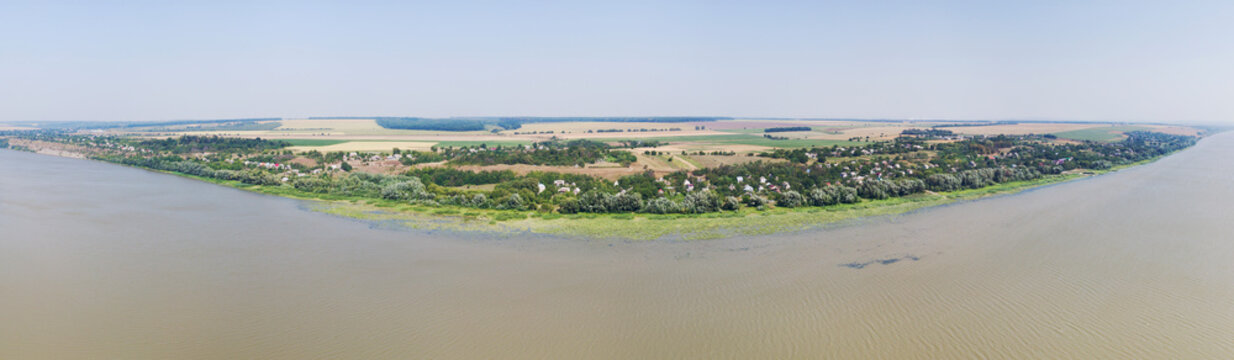 Aerial panoramic view of Braha village and Dniester river, oblast Chernivtsi, Ukraine.