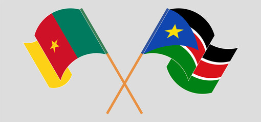 Crossed and waving flags of Cameroon and South Sudan