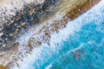 Aerial view of breaking waves, forming an abstract pattern, Maldives.