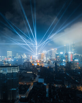 Shanghai, China - 29 September 2019: Aerial view of Shanghai skyline during laser show at night, China.