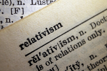 Word "relativism" printed on dictionary page, macro close-up	