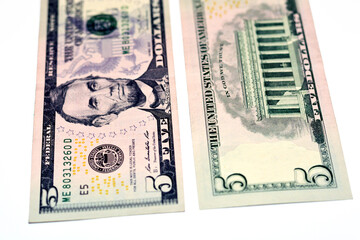 Selective focus of 5 five dollars bill banknote features the portrait of president Abraham Lincoln,...