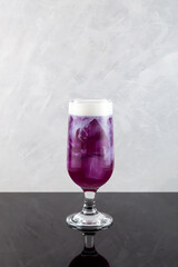 Sweet potato Latte with ice cubes. Purple cocktail, Summer refreshing drink