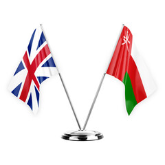 Two table flags isolated on white background 3d illustration, great britain and oman