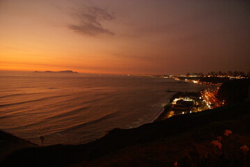 Sunsets over the beach in Lima, Peru