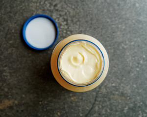 The top of the mayonnaise in a newly opened jar.