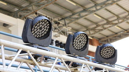 LED Moving Head Lights. Rotating LED lighting on metal stand for concert stage lighting on roof...