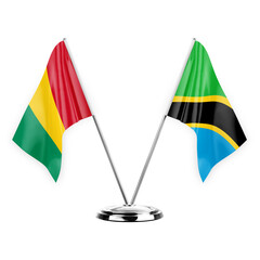 Two table flags isolated on white background 3d illustration, guinea and tanzania